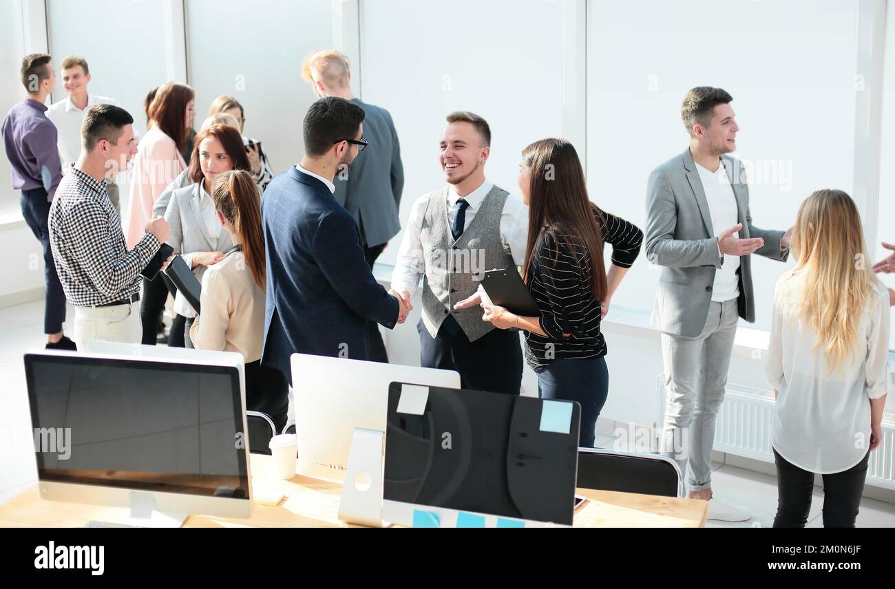Young employees discussing work hi-res stock photography and images - Alamy