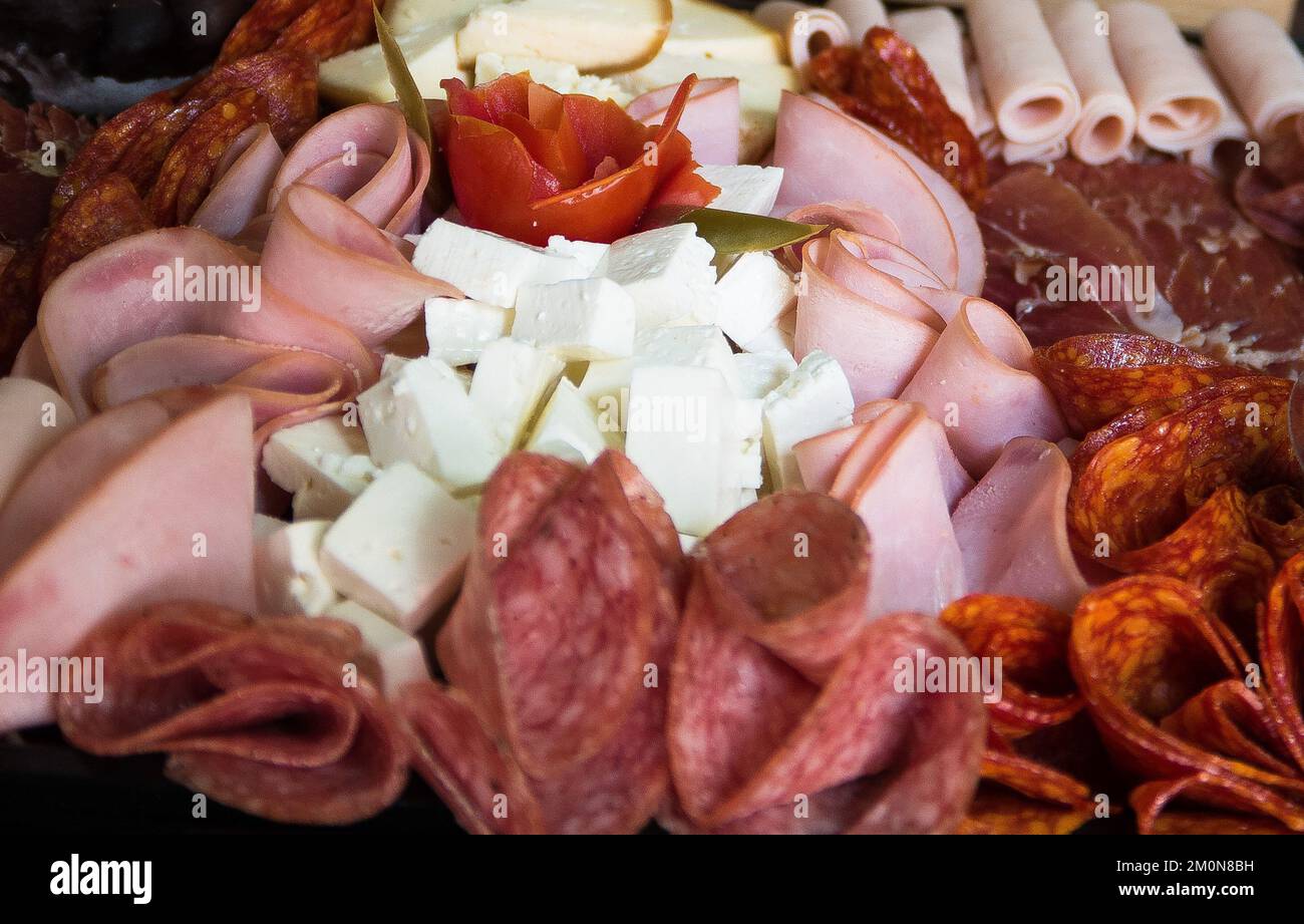 A closeup shot of a table with mix of meats and cheese Stock Photo