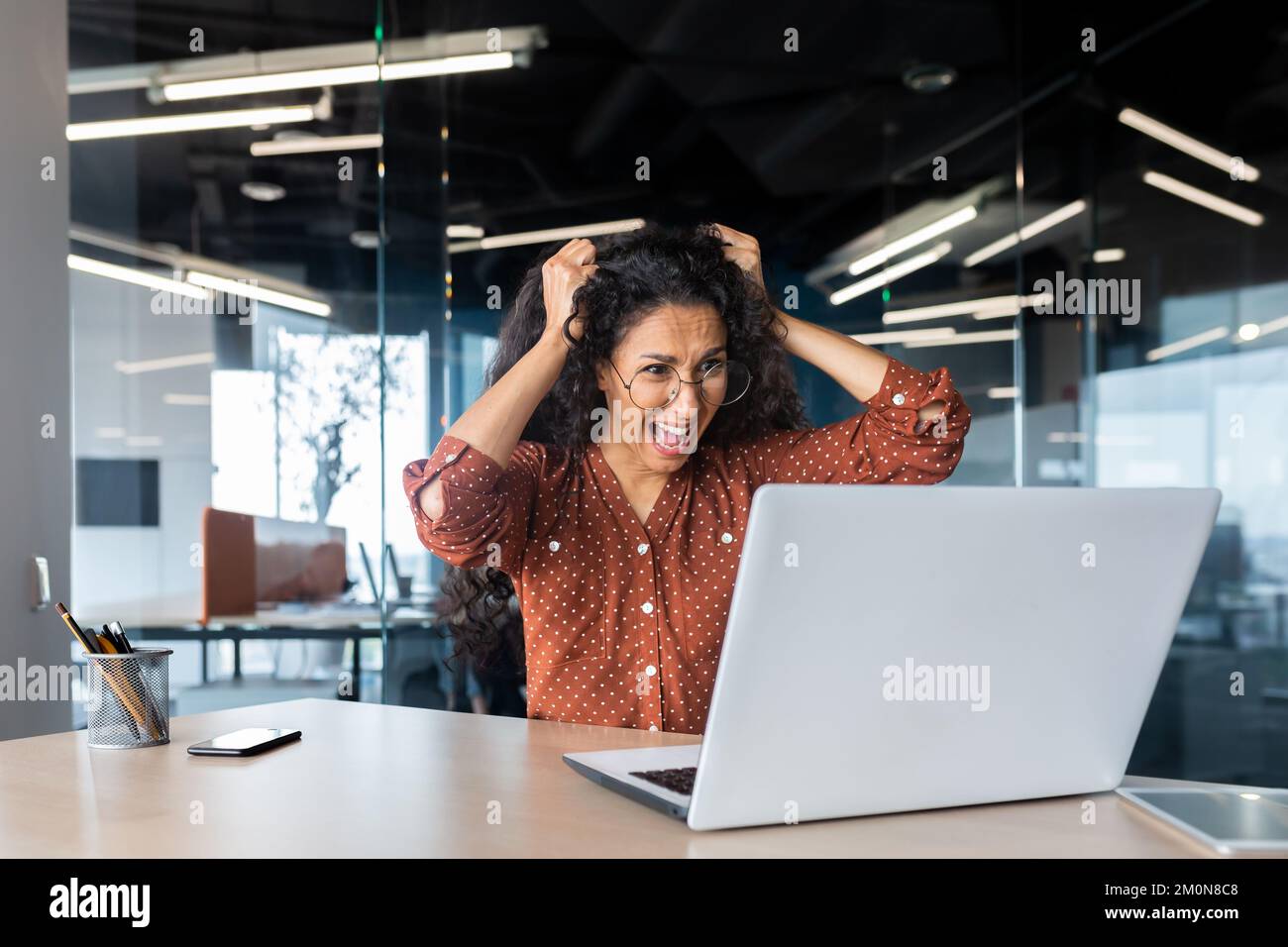 Upset woman at work yelling at laptop monitor, angry businesswoman ...