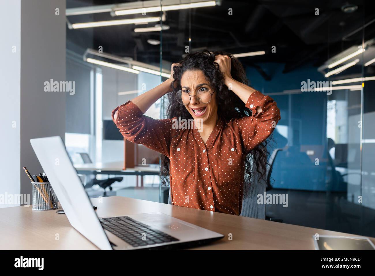 Upset woman at work yelling at laptop monitor, angry businesswoman ...