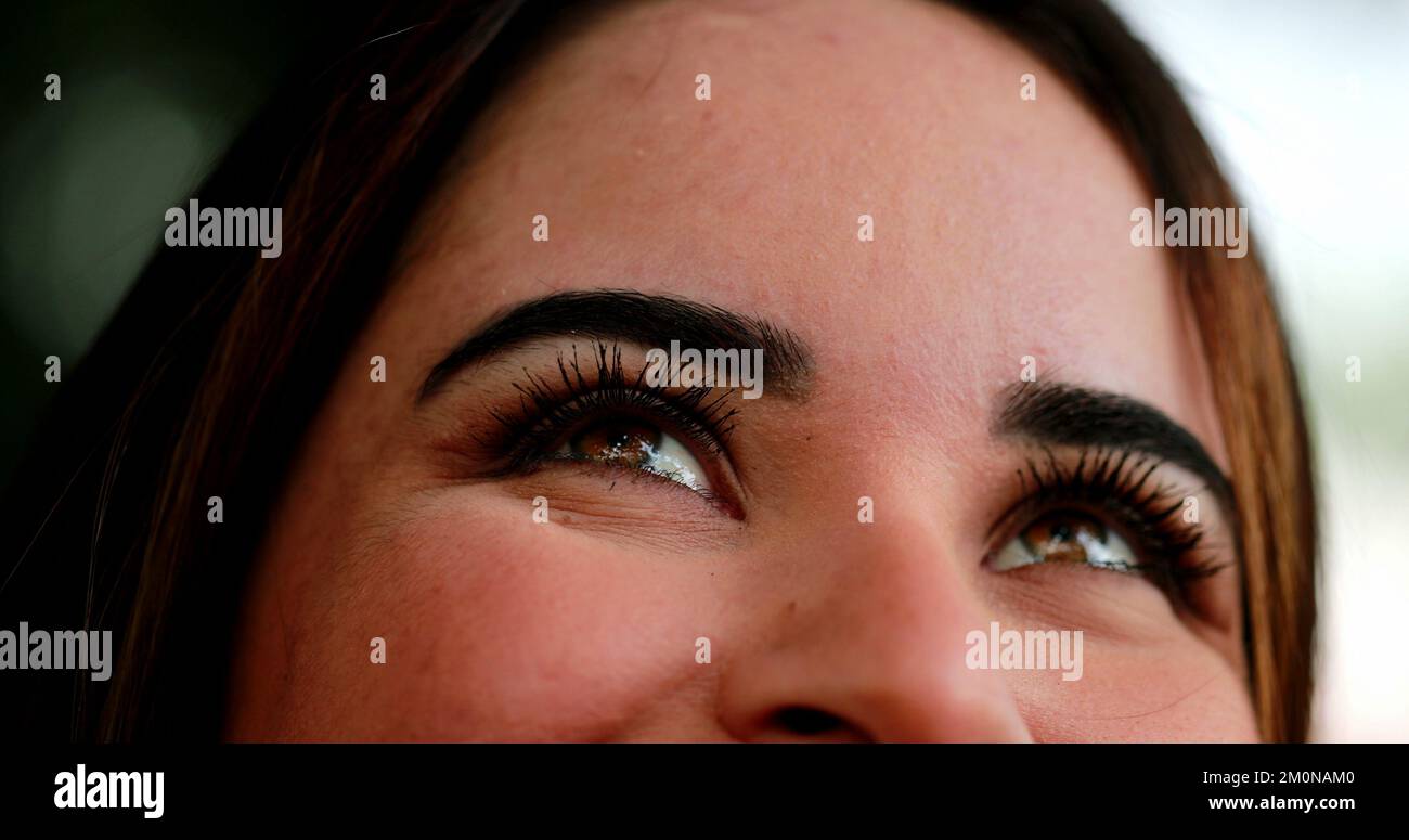 Young woman closeup face opening eyes to sky smiling Stock Photo Alamy