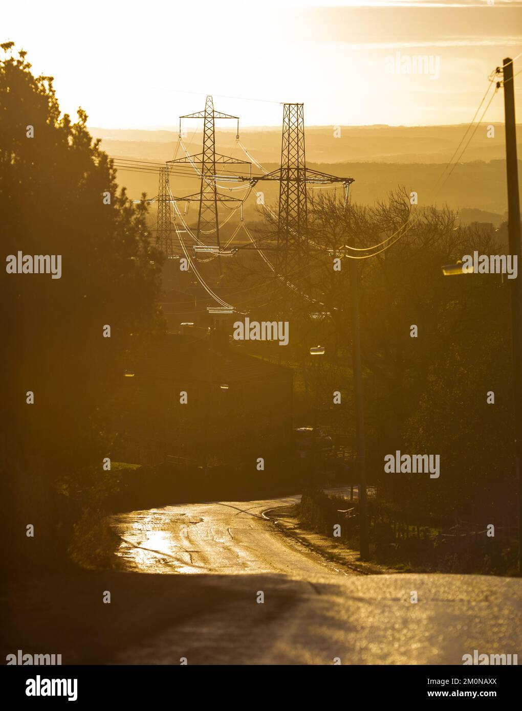 Pylons at the bottom of a lane and hill bear Halifax, West Yorkshire on