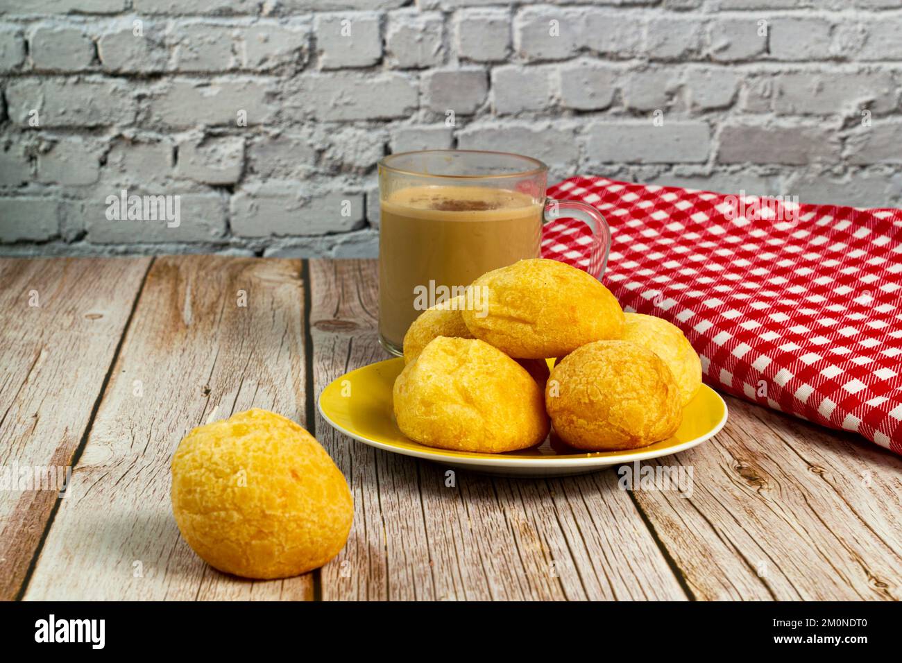 Traditional Brazilian breakfast, cheese bread, and coffee with milk. Selective focus. Stock Photo