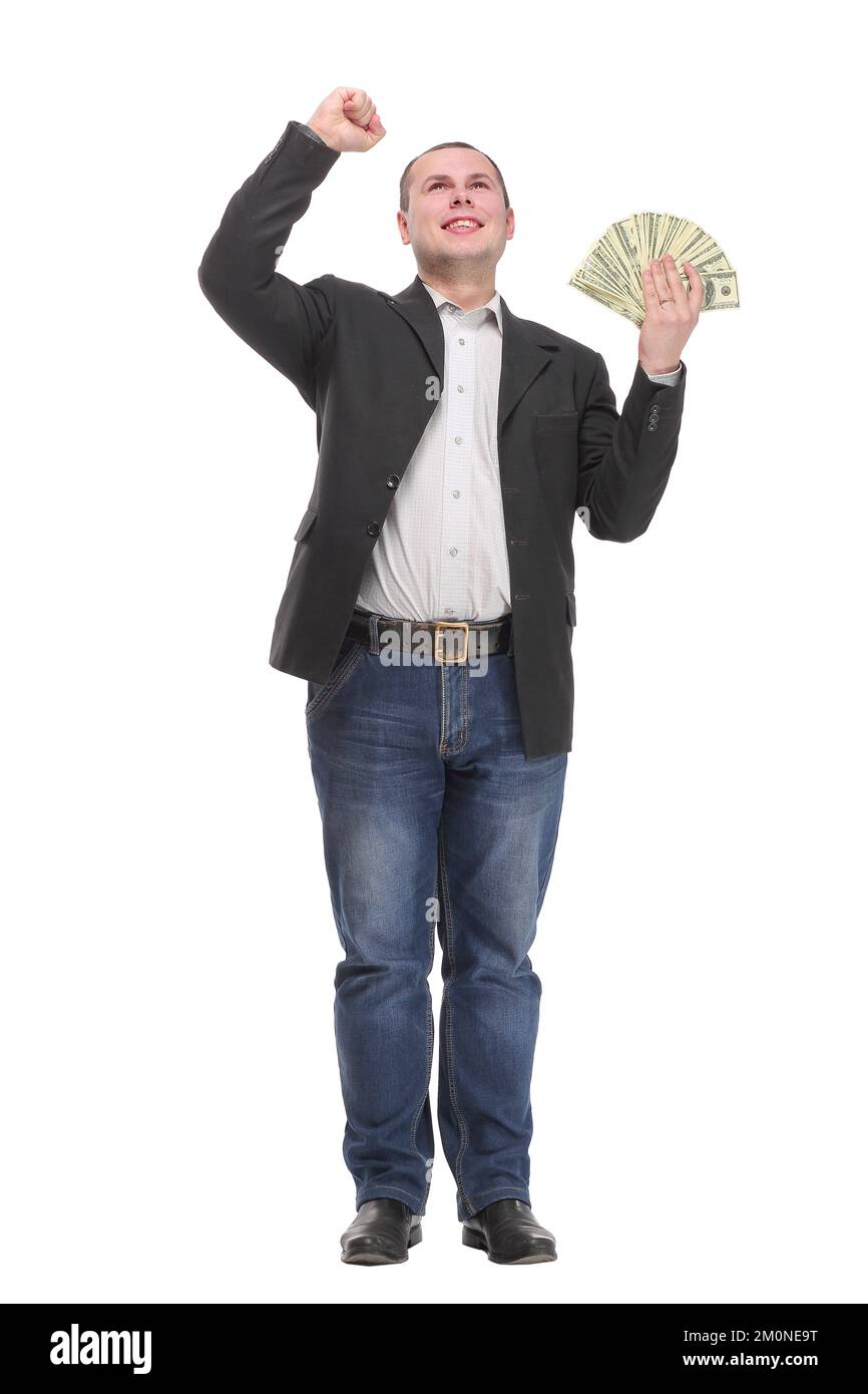 Happy young man holding money while standing and arm up Stock Photo