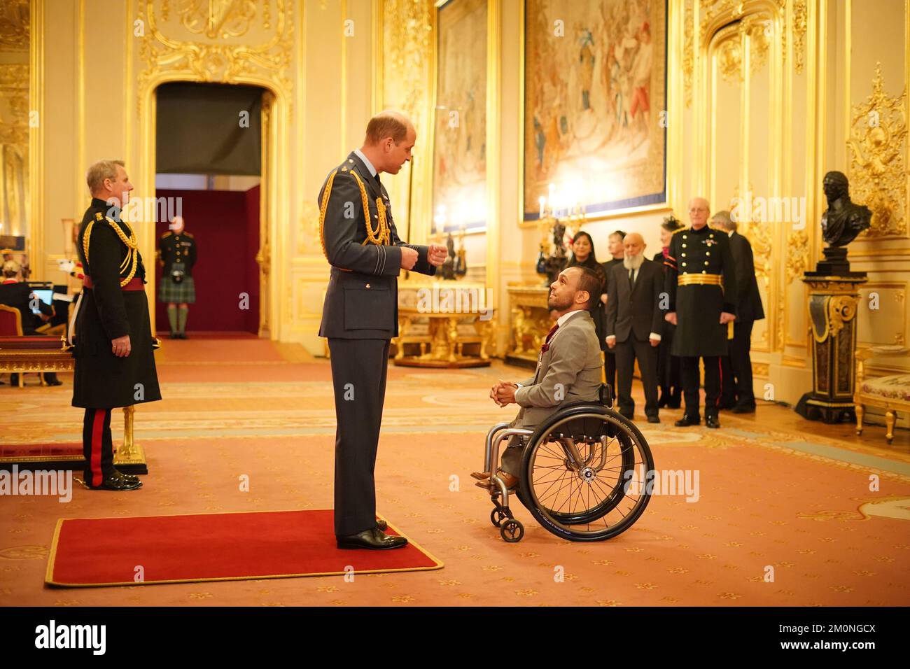 Mr. Ayaz Bhuta, from Bolton, is made a Member of the Order of the British Empire by the Prince of Wales at Windsor Castle. The award was for services to wheelchair rugby. Picture date: Wednesday December 7, 2022. Stock Photo