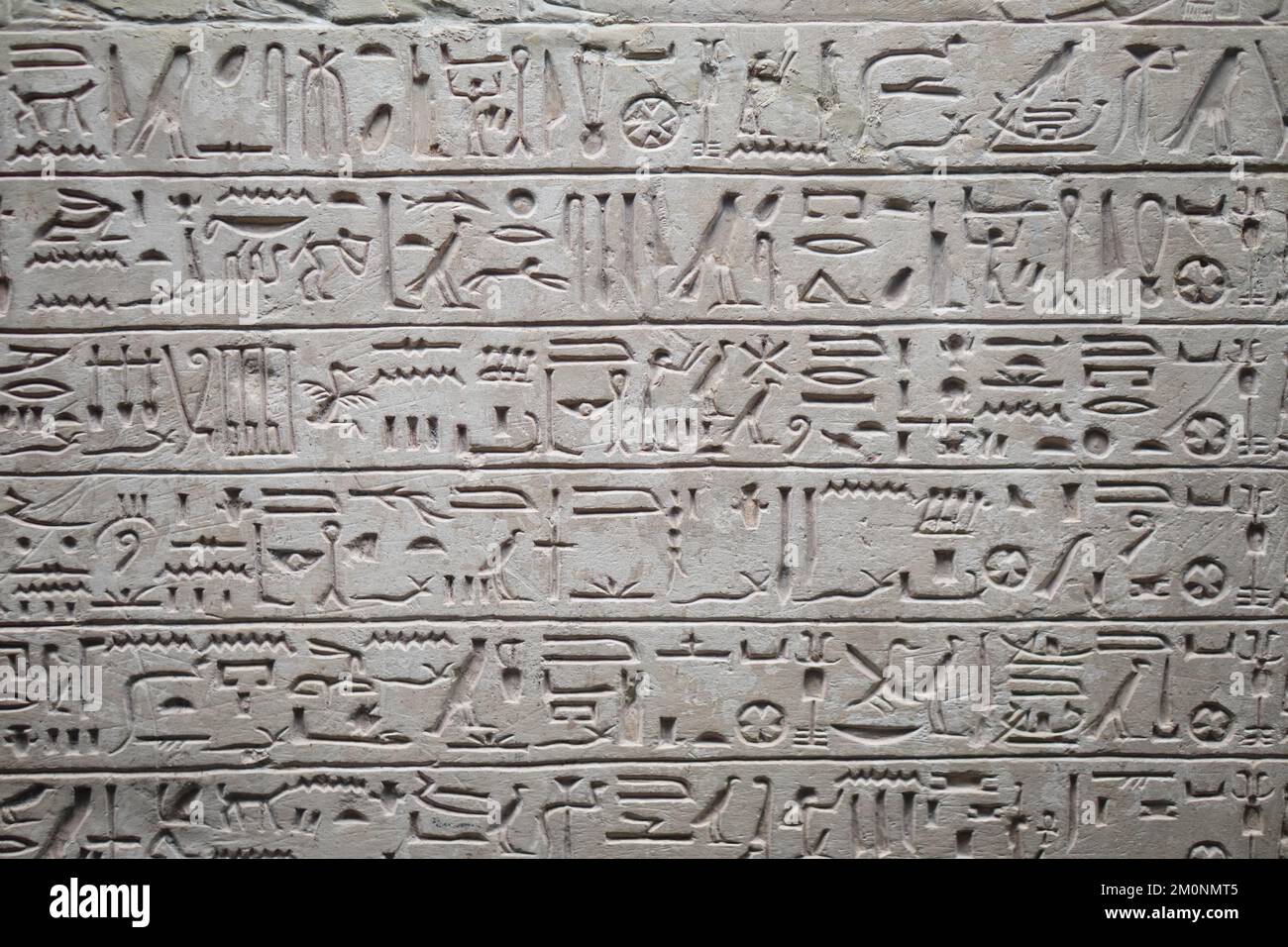 A closeup of the well-preserved ancient Egyptian hieroglyphs on the wall of the temple Stock Photo