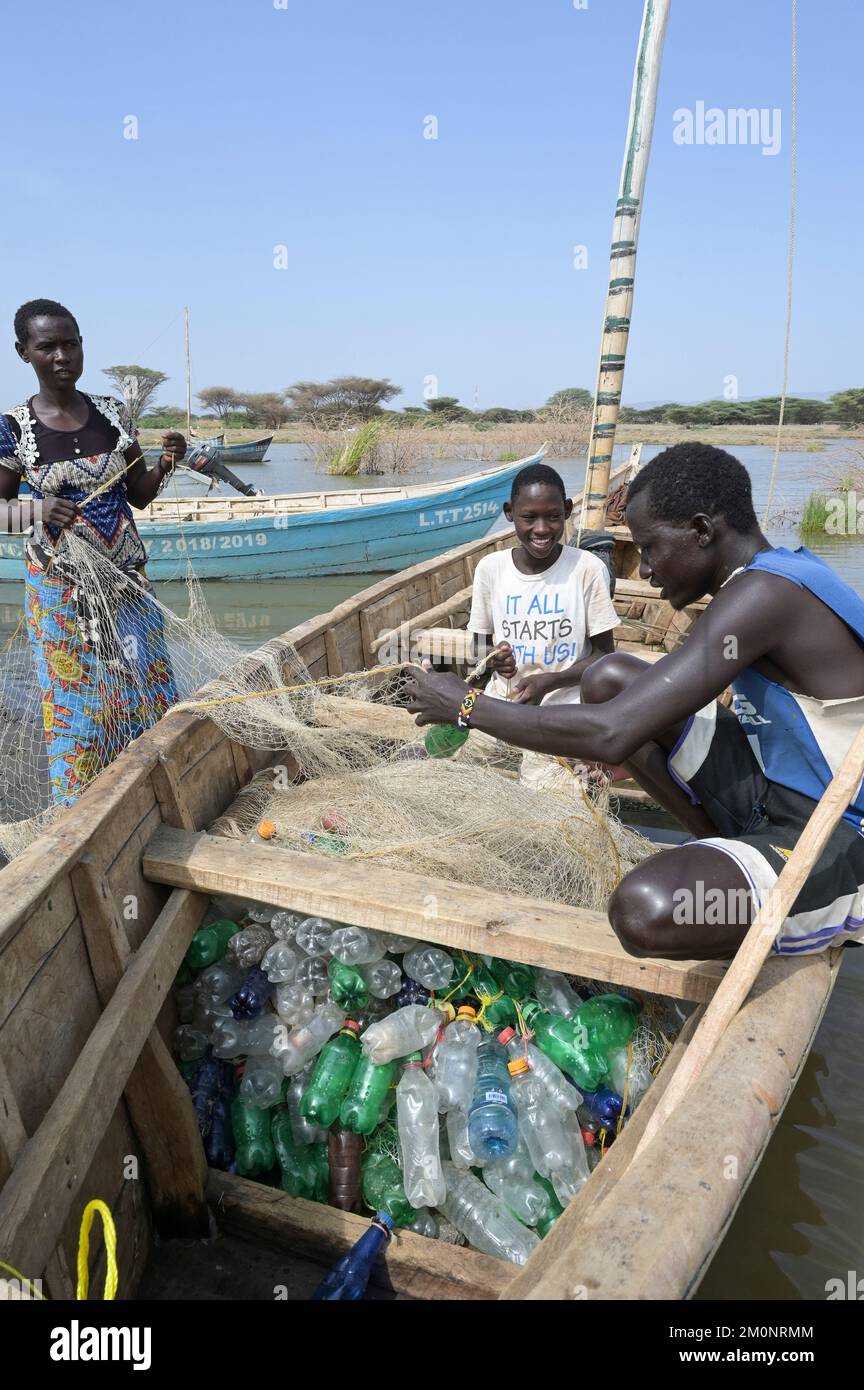 KENYA, Turkana, village Anam at Lake Turkana, fisherman, plastic waste, old PET softdrink
