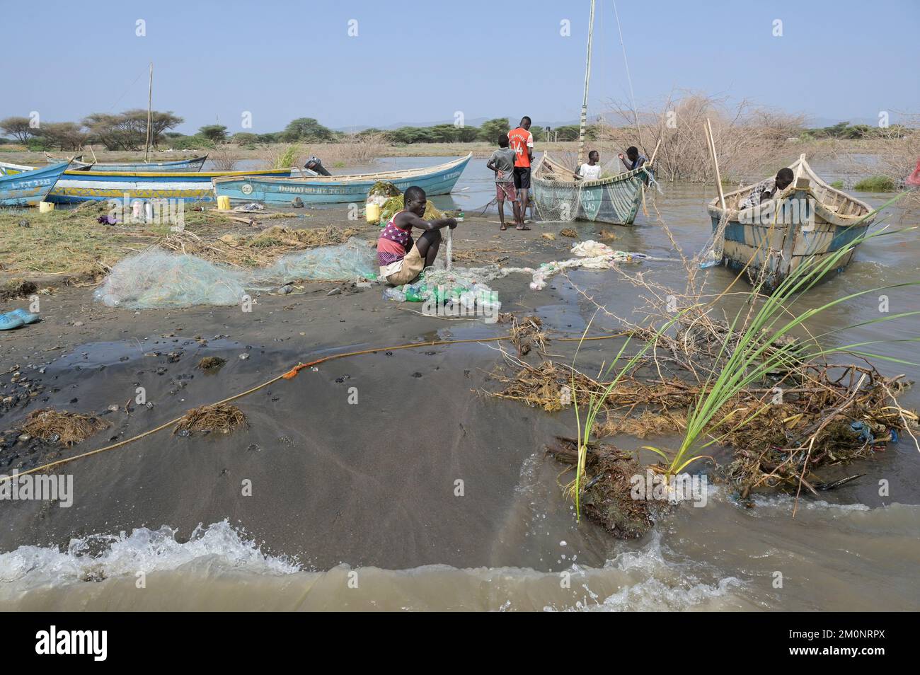 KENYA, Turkana, village Anam at Lake Turkana, fisherman, plastic waste, old PET softdrink