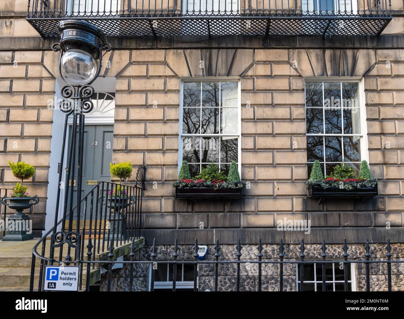 Georgian house front door with Christmas decorations and old fashioned lamp post, Edinburgh New Town, Scotland, UK Stock Photo