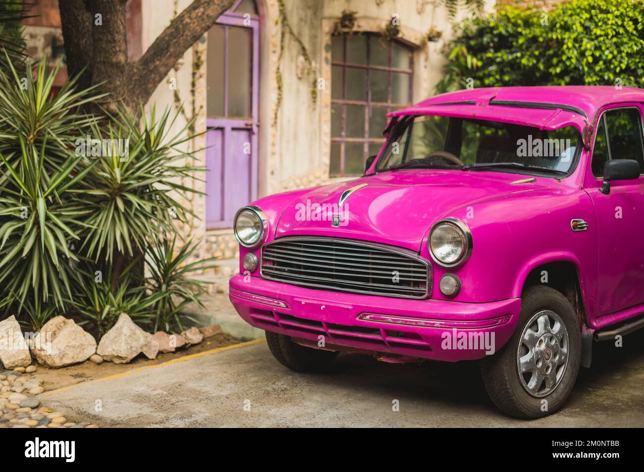 A purple vintage car on the street. Gurugram, India Stock Photo Alamy