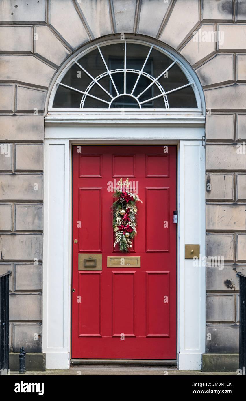 townhouse fanlight and red front door with Christmas