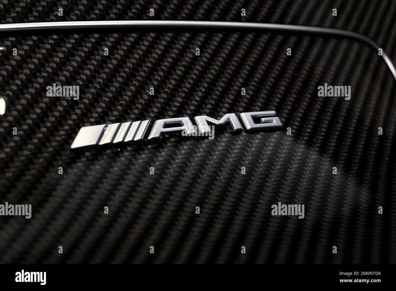 A Closeup Shot Of The Mercedes Benz Amg Badge On Carbon Fiber Center Console Stock Photo Alamy