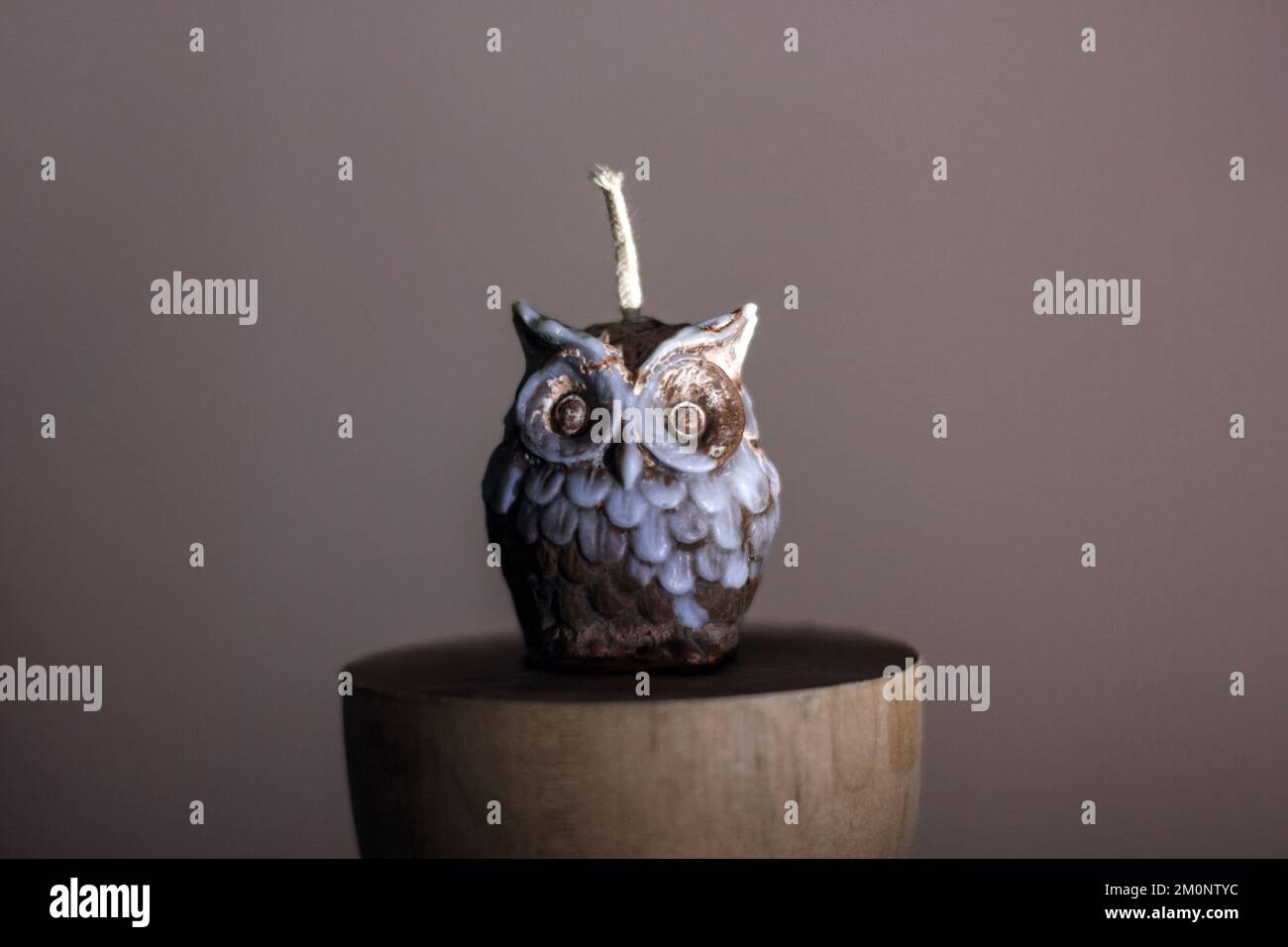 A candle in the shape of an owl. Holiday advent. Beautiful handmade