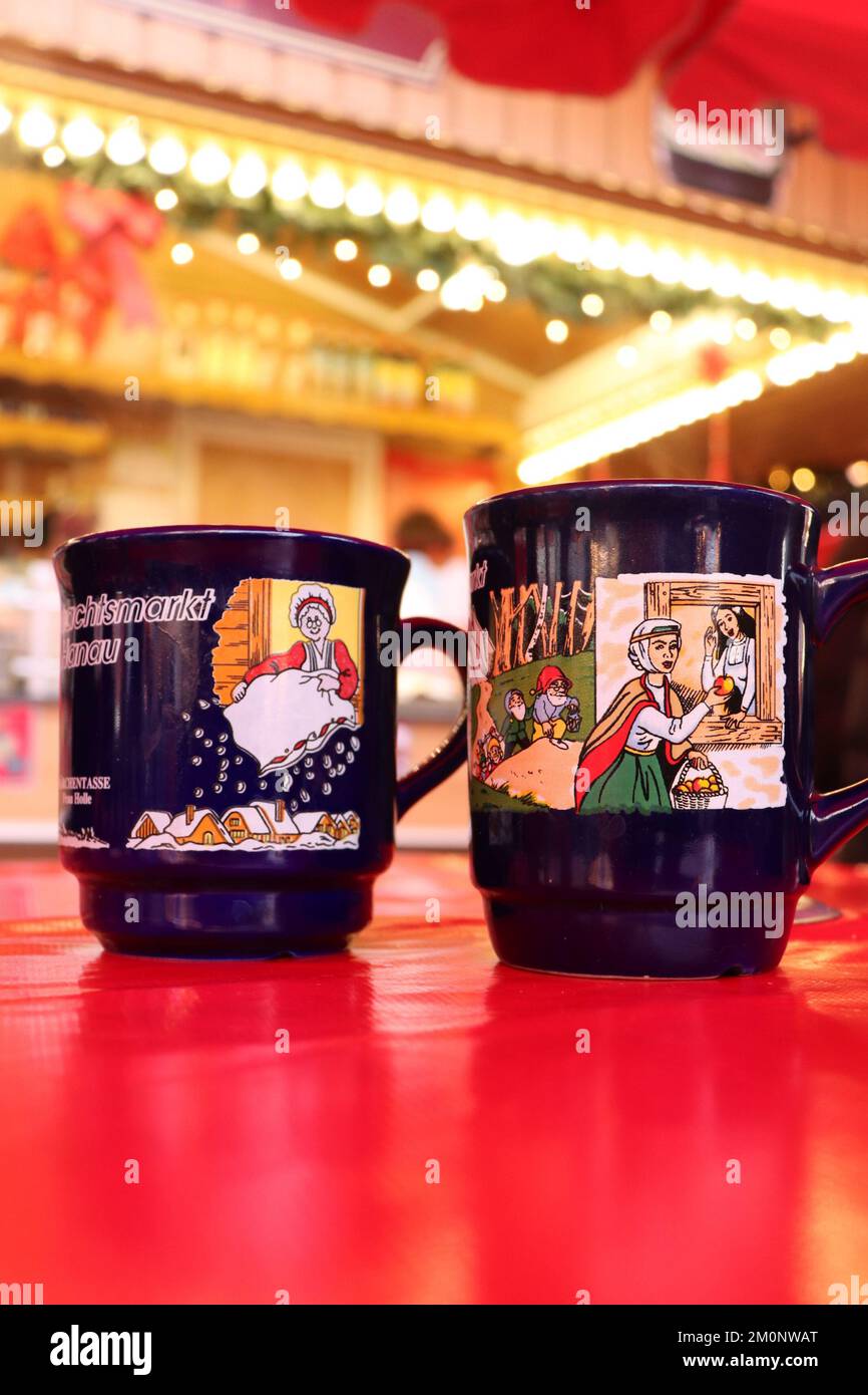 Hanau, Germany December 15, 2019 Two mugs on a red table at a