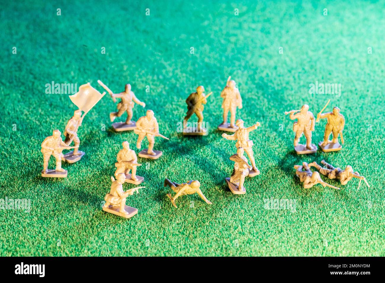 Airfix HO/00 scale plastic model figures. Japanese infantry from world war two, various figures in poses on green grass texture background Stock Photo