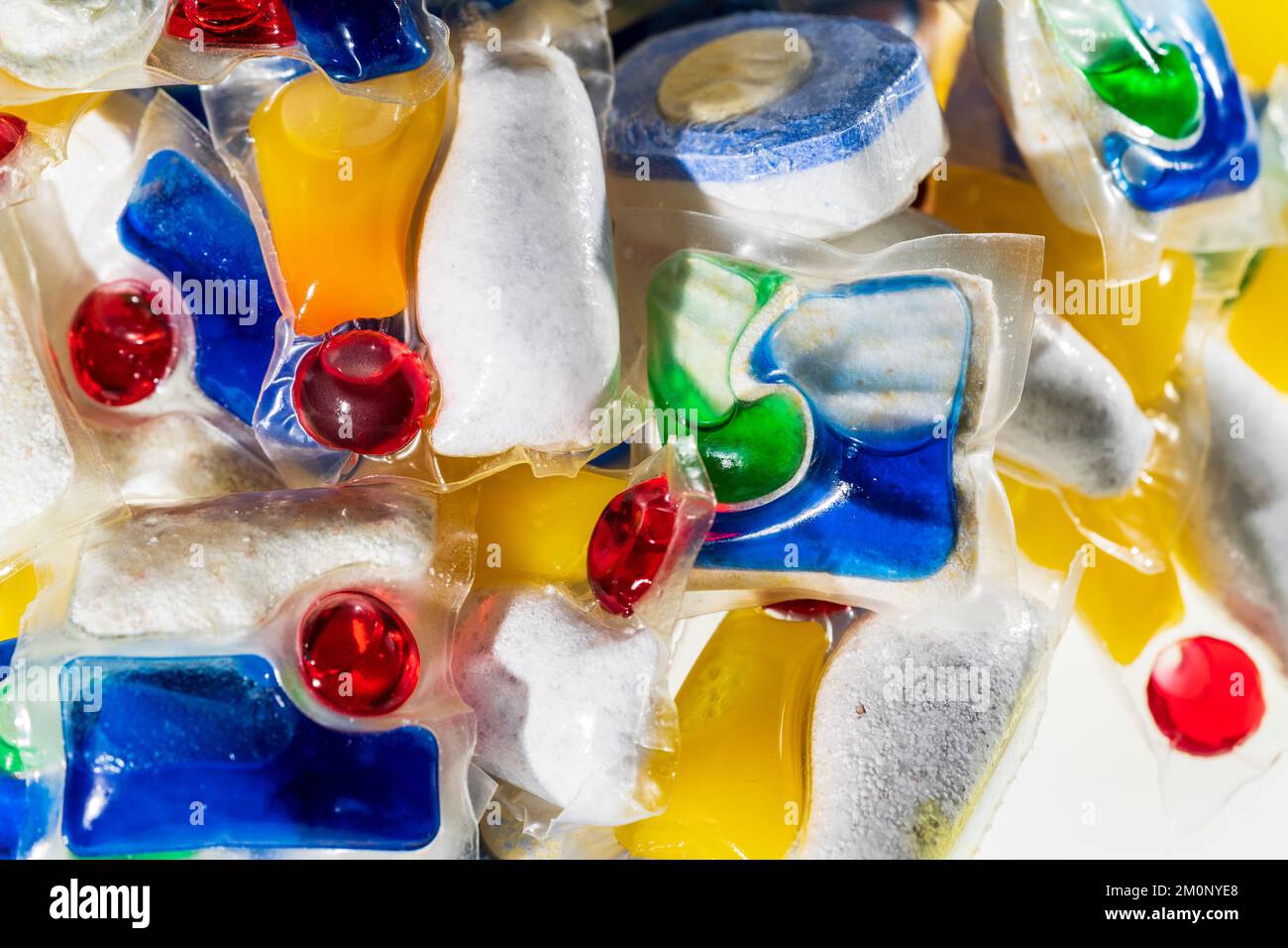 Dishwasher tablets. Close up of various brands, (no brand names showing), of household dishwasher tablets in a pile. Stock Photo