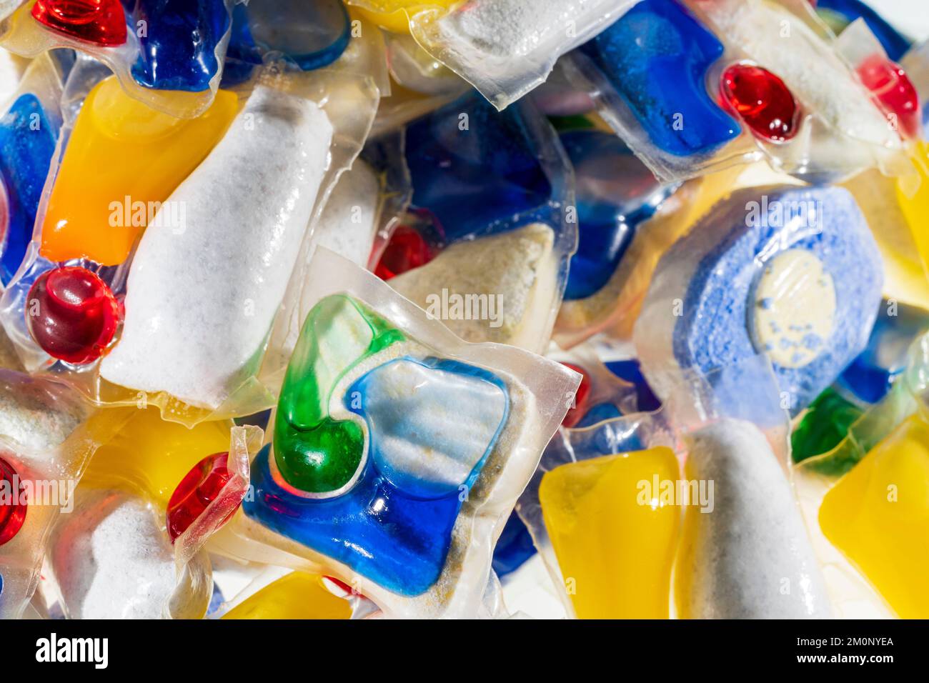 Dishwasher tablets. Close up of various brands, (no brand names showing), of household dishwasher tablets in a pile. Stock Photo