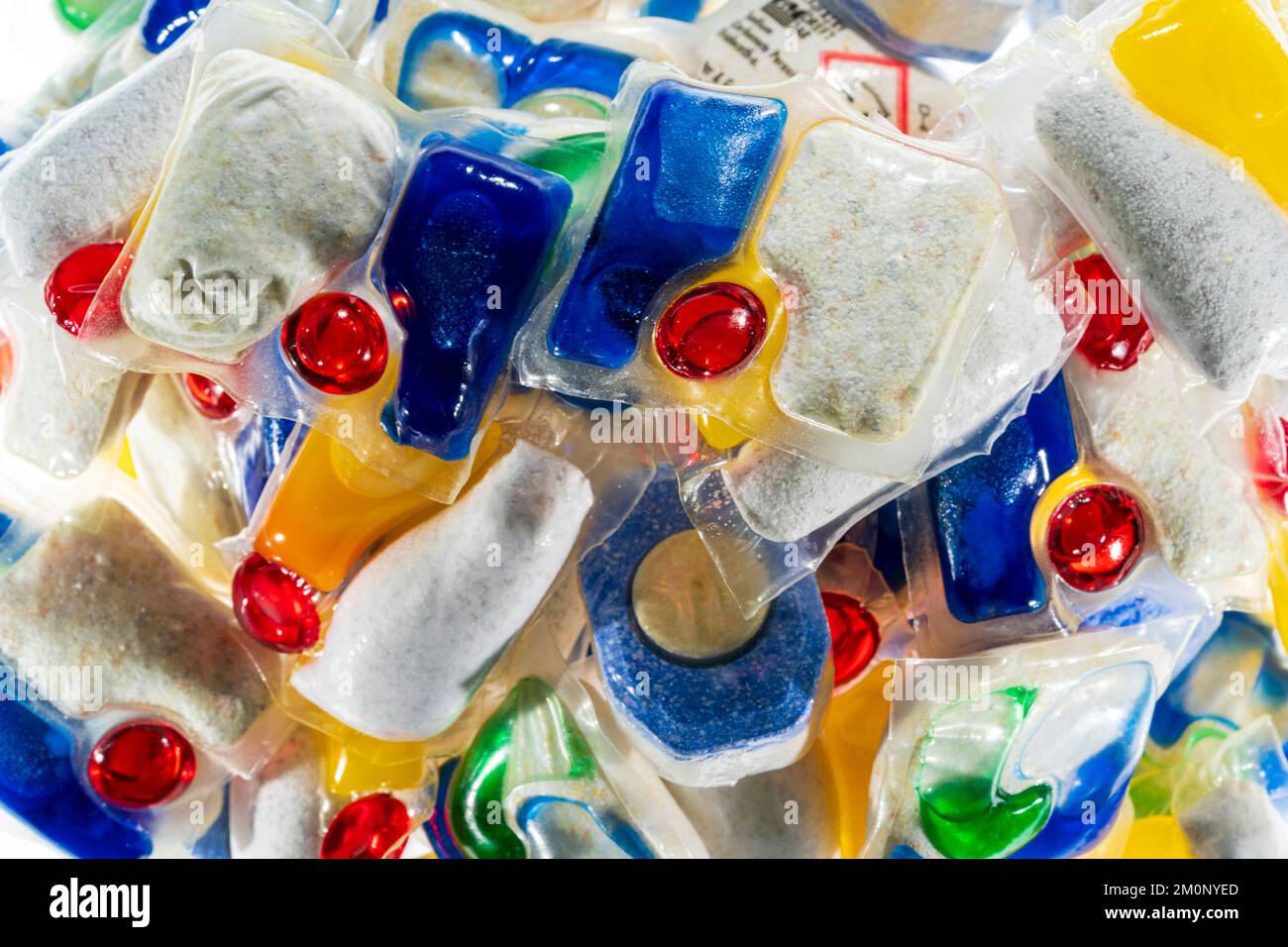 Dishwasher tablets. Close up of various brands, (no brand names showing), of household dishwasher tablets in a pile. Stock Photo