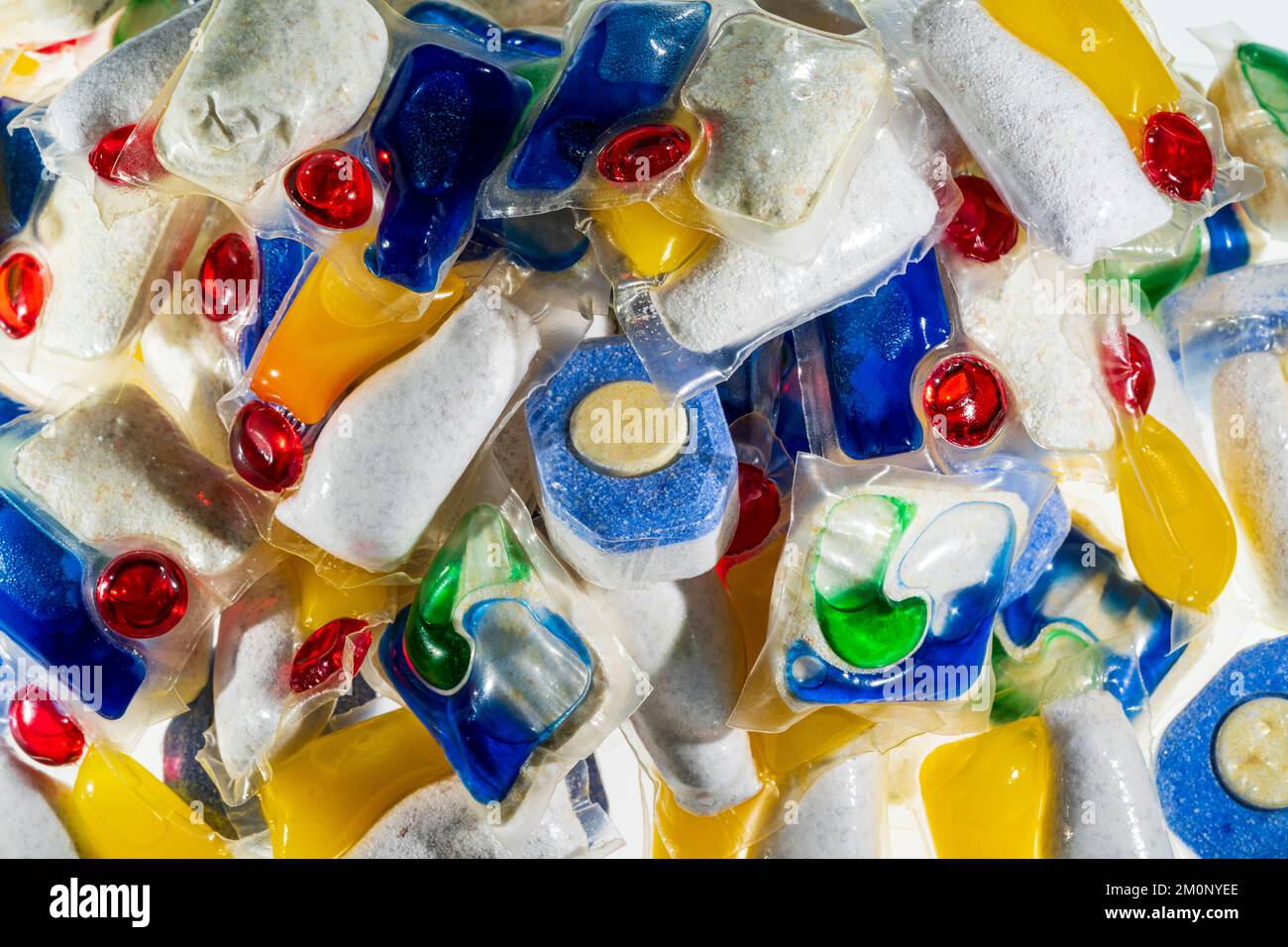 Dishwasher tablets. Close up of various brands, (no brand names showing), of household dishwasher tablets in a pile. Stock Photo