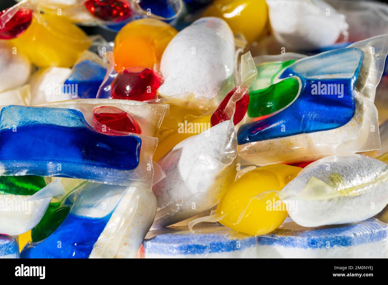 Dishwasher tablets. Close up of various brands, (no brand names showing), of household dishwasher tablets in a pile. Stock Photo