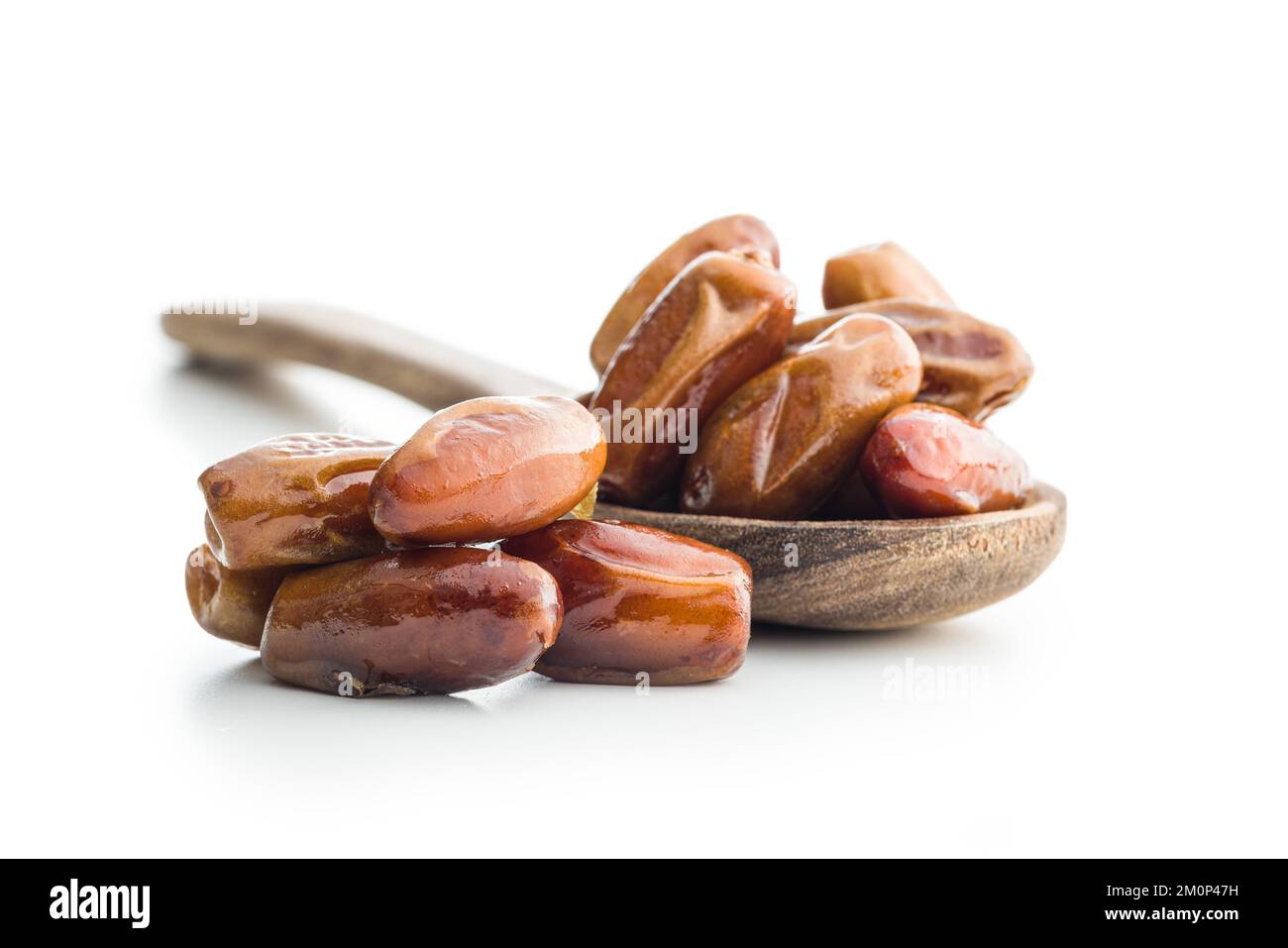 Dried dates fruit in spoon isolated on the white background Stock Photo ...