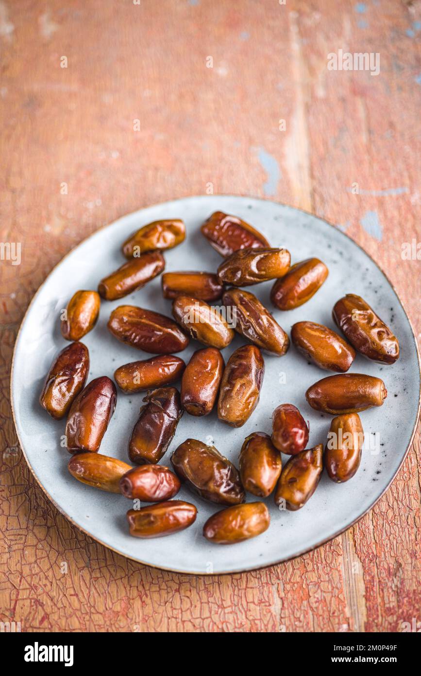 Dried dates fruit on the plate. Stock Photo