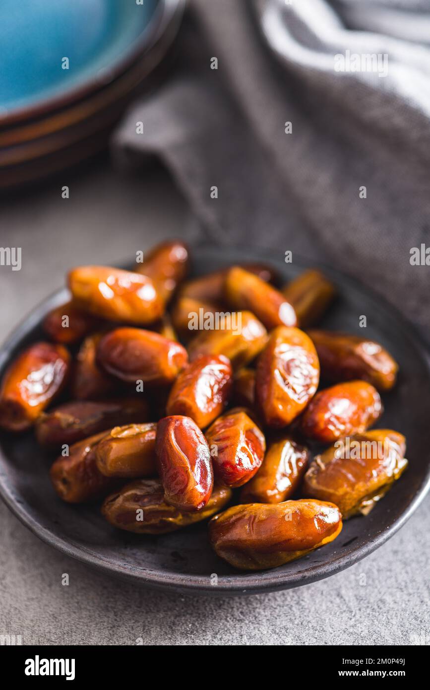Dried dates fruit on the plate. Stock Photo