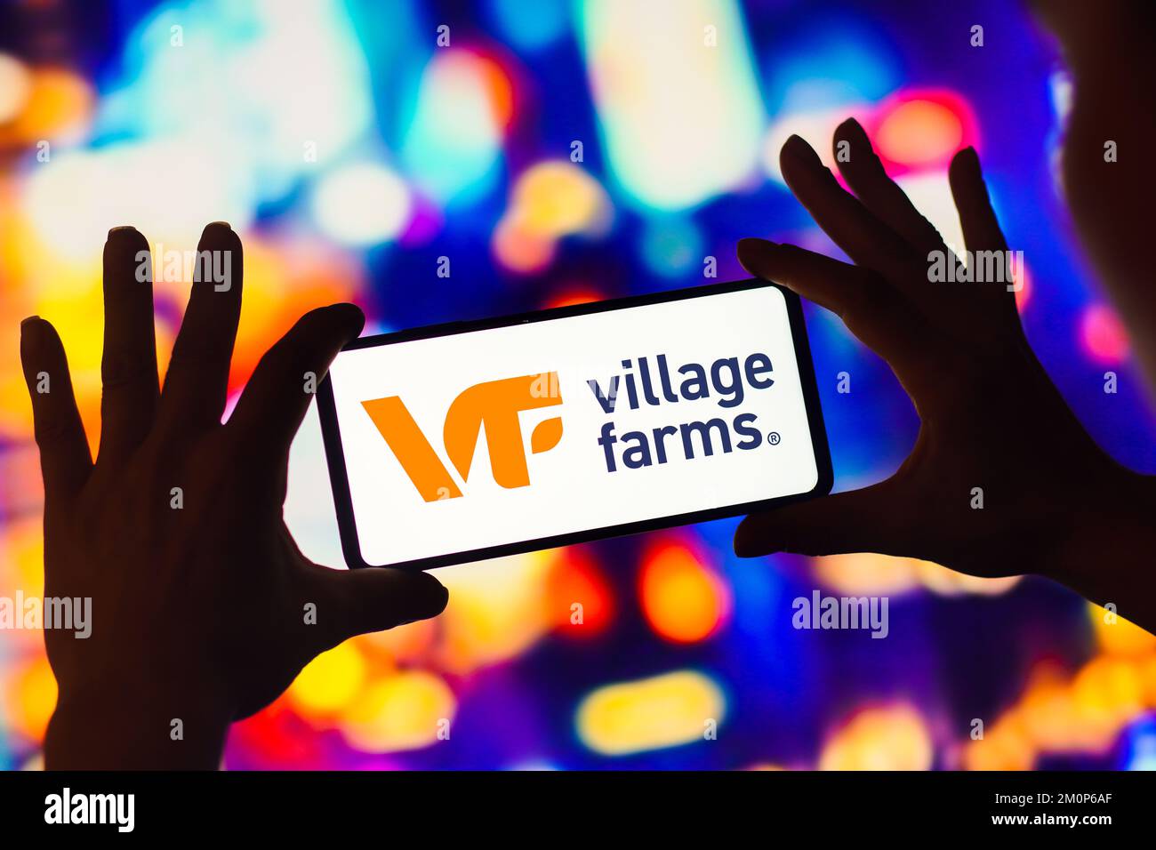 In this photo illustration, the Village Farms International logo is
