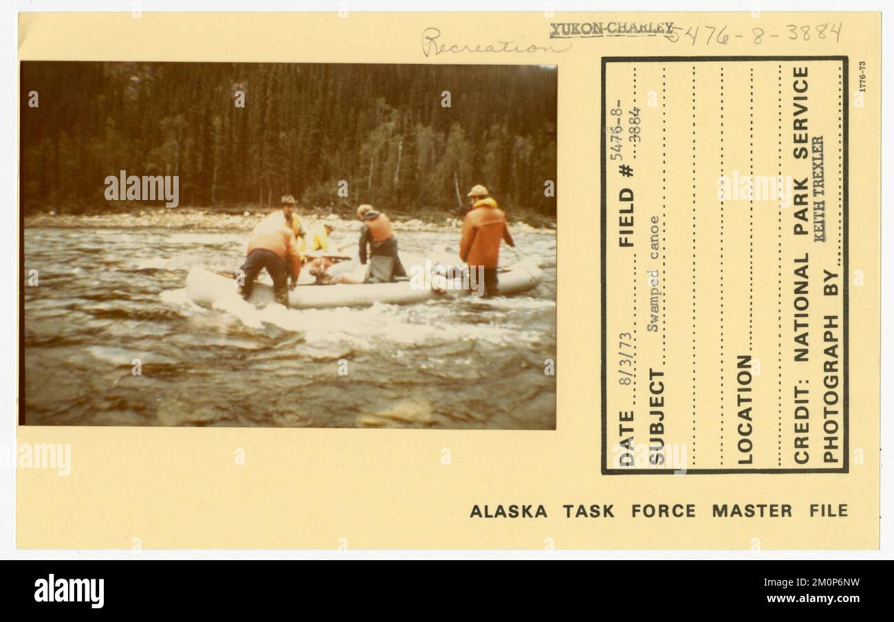 Swamped canoe. Alaska Task Force Photographs Stock Photo - Alamy