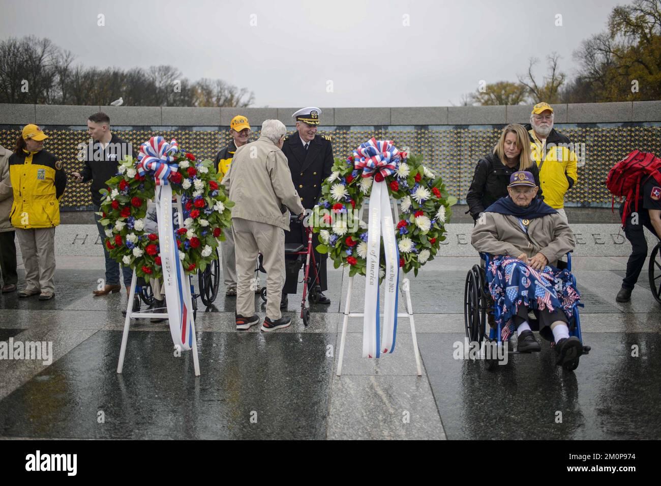Washington, United States. 07th Dec, 2022. Members of the National Park Service mingle with World War II veterans during wreath-laying ceremony held by The National Parks Service and The Friends of the National World War II Memorial to commemorate the 81st anniversary of the Battle of Pearl Harbor at the National World War II Memorial in Washington, DC on Wednesday, December 7, 2021. Photo by Bonnie Cash/UPI Credit: UPI/Alamy Live News Stock Photo