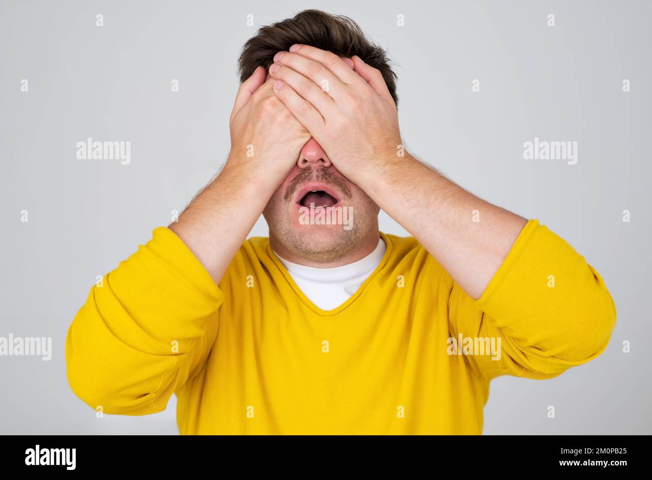 Anonymous caucasian man hiding his identity . Studio shot Stock Photo