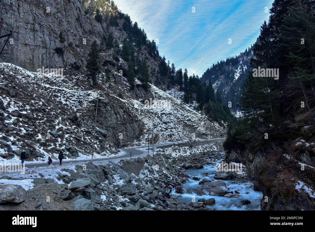 Sonamarg, India. 07th Dec, 2022. Visitors take pictures on the Srinagar-Ladakh national highway during a cold winter day in Sonamarg, about 100kms northeast of Srinagar, the summer capital of Jammu and Kashmir. (Photo by Saqib Majeed/SOPA Images/Sipa USA) Credit: Sipa USA/Alamy Live News Stock Photo