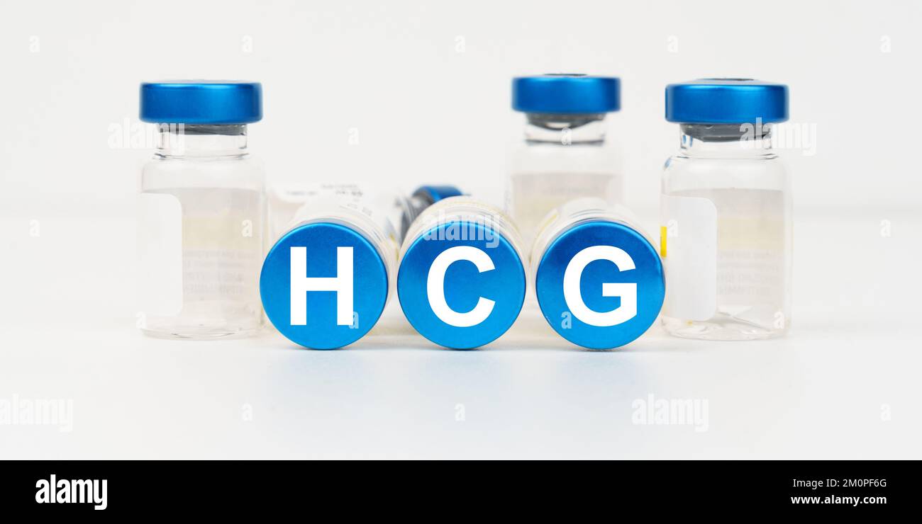 Medicine and health concept. On the blue roofs of the injections it says - HCG Stock Photo