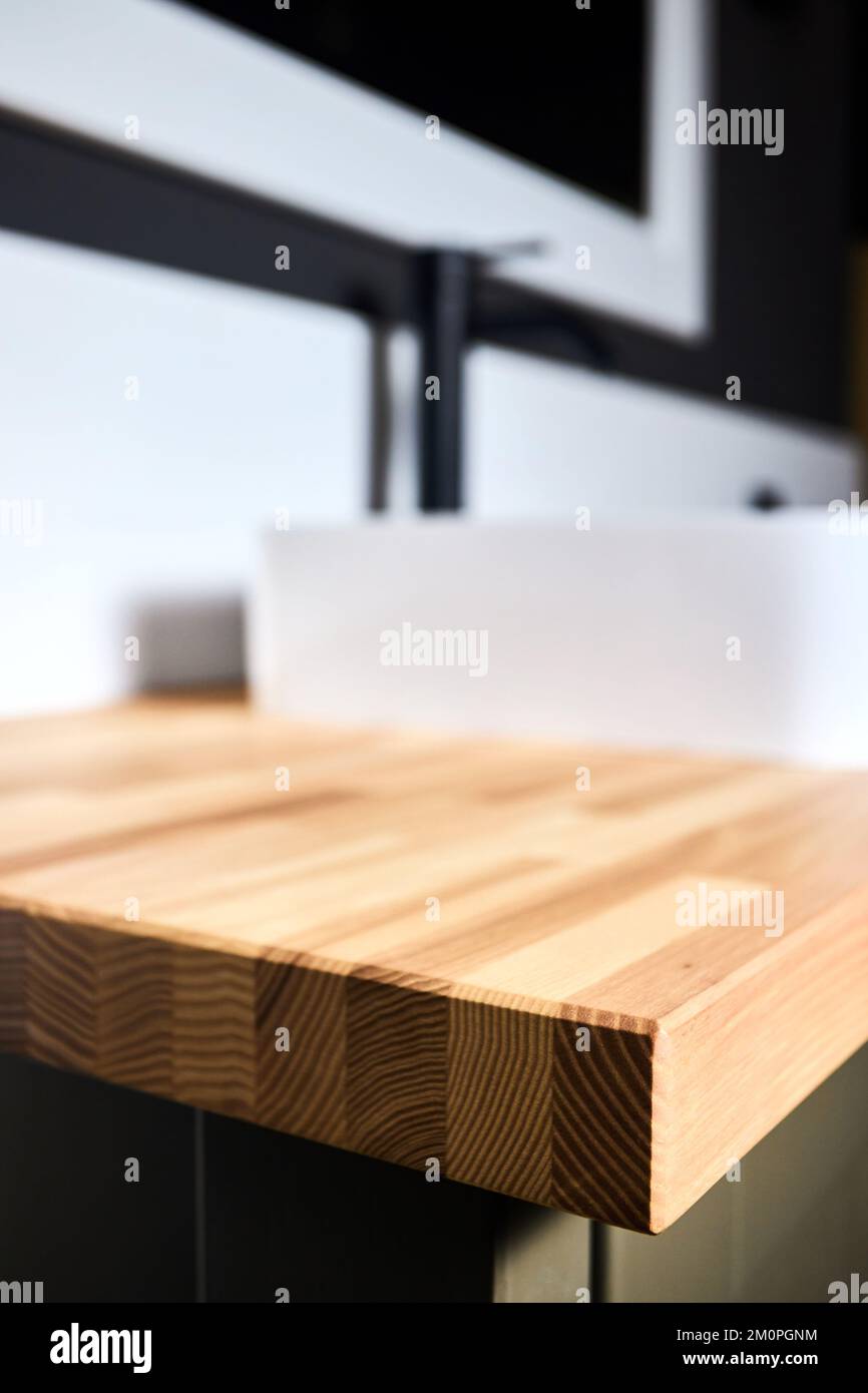 Solid ash glued timber under varnish edge corner table top selective focus  macro closeup. Bathroom interior contemporary design countertop tabletop  Stock Photo - Alamy