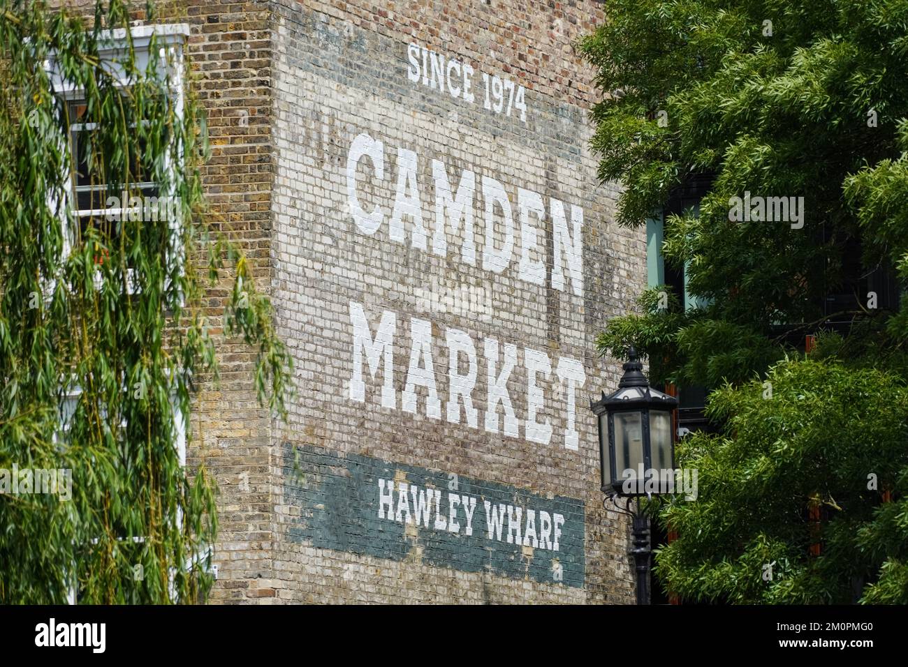 Camden Market mural on a brick wall, Camden Town, London England United Kingdom UK Stock Photo