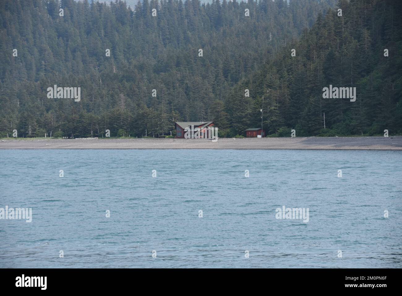 Remote cabin in Alaska along the ocean Stock Photo Alamy
