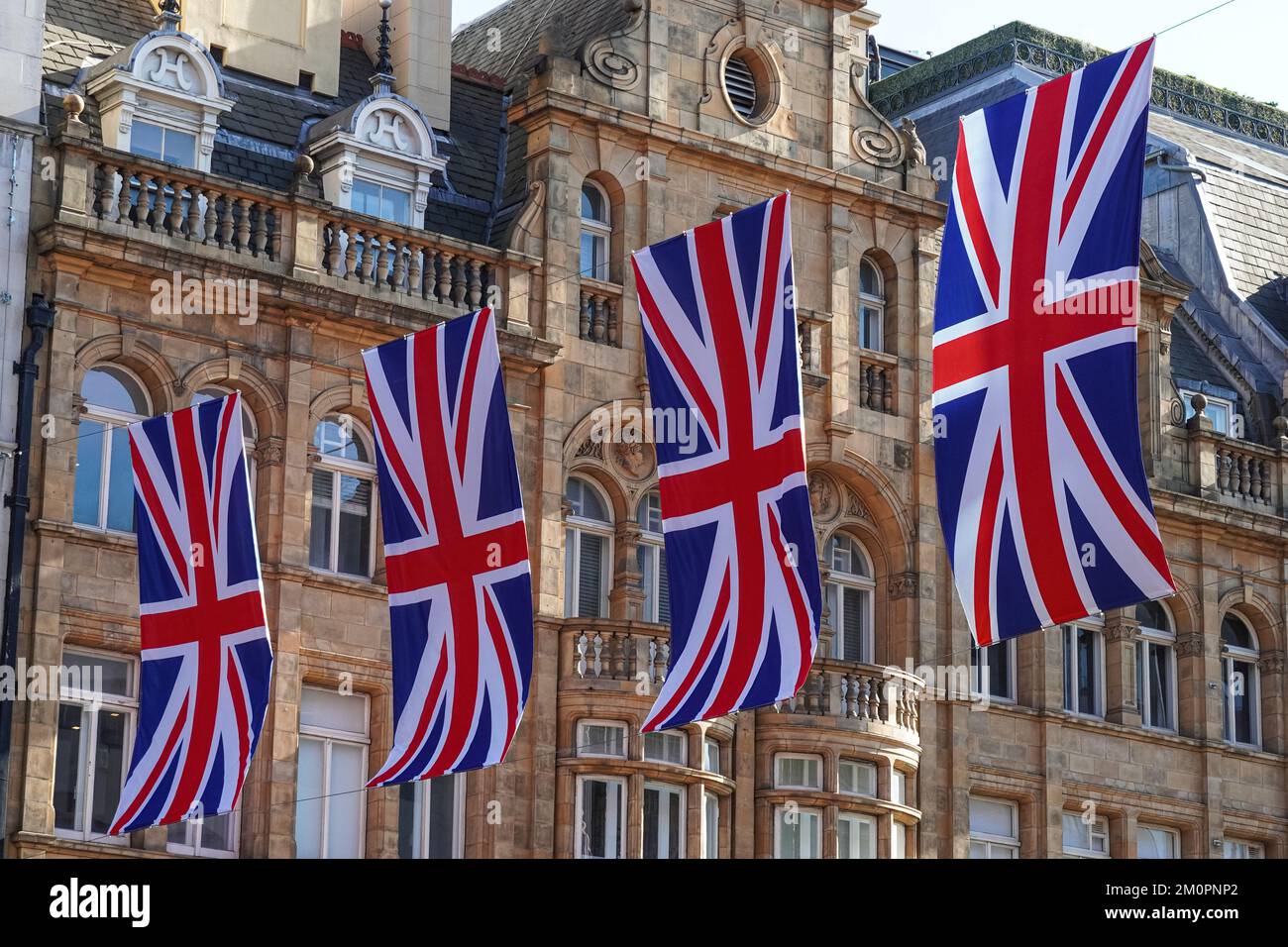Union Jack, British flag bunting above street in London, England United Kingdom UK Stock Photo
