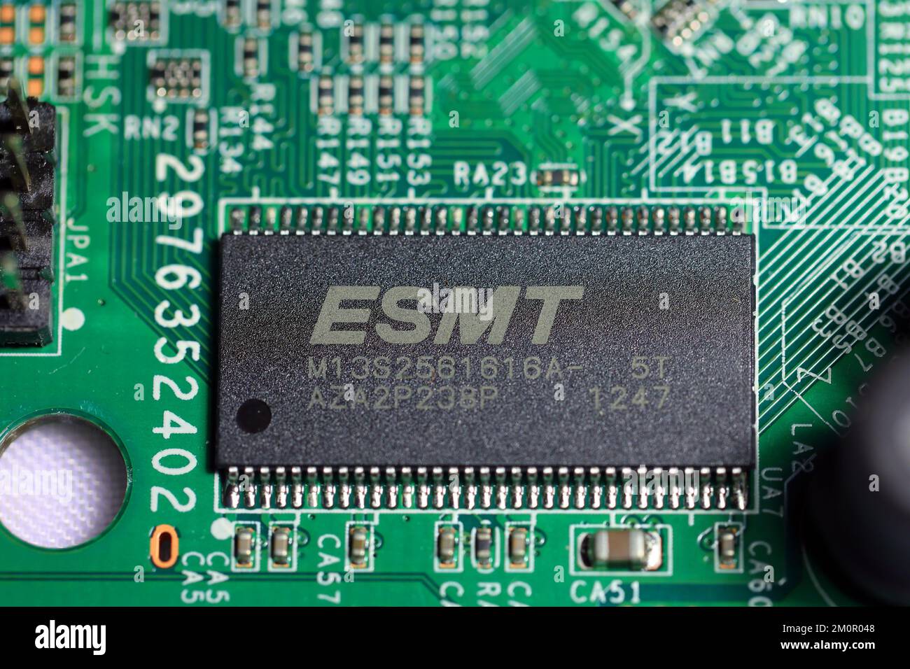 An ESMT memory chip on an integrated circuit board. Elite Semiconductor Microelectronics Technology is a Taiwanese chip maker. Stock Photo