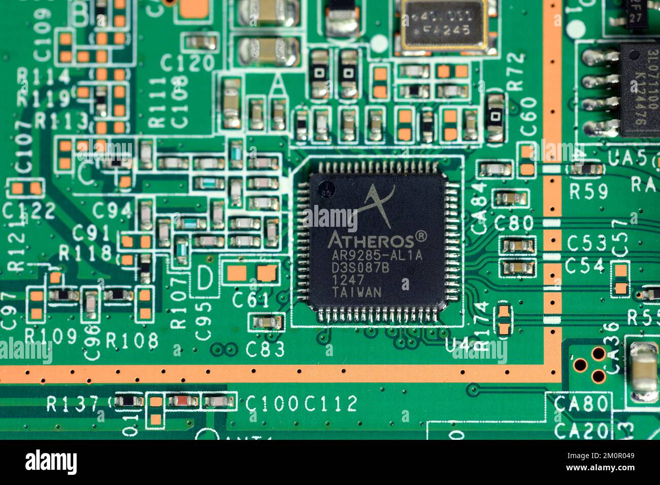 An Atheros Communications AR9285 wireless LAN controller on an integrated circuit board. The Taiwanese wireless chip maker was purchased by Qualcomm i Stock Photo