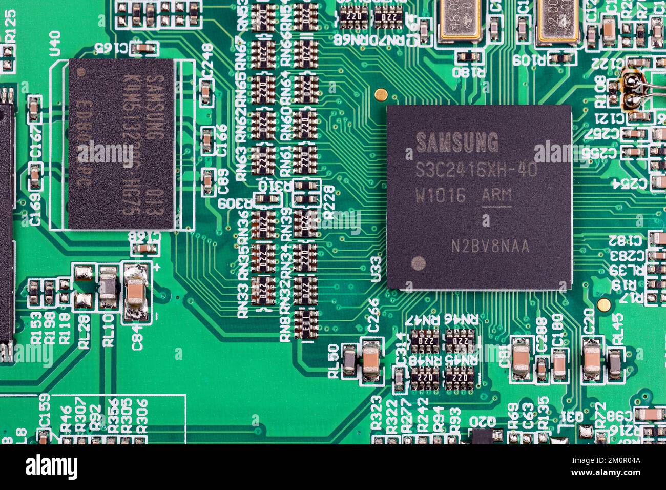 A Samsung Semiconductor RISC microcontroller and DRAM on an integrated circuit board controlling a handheld device. Stock Photo