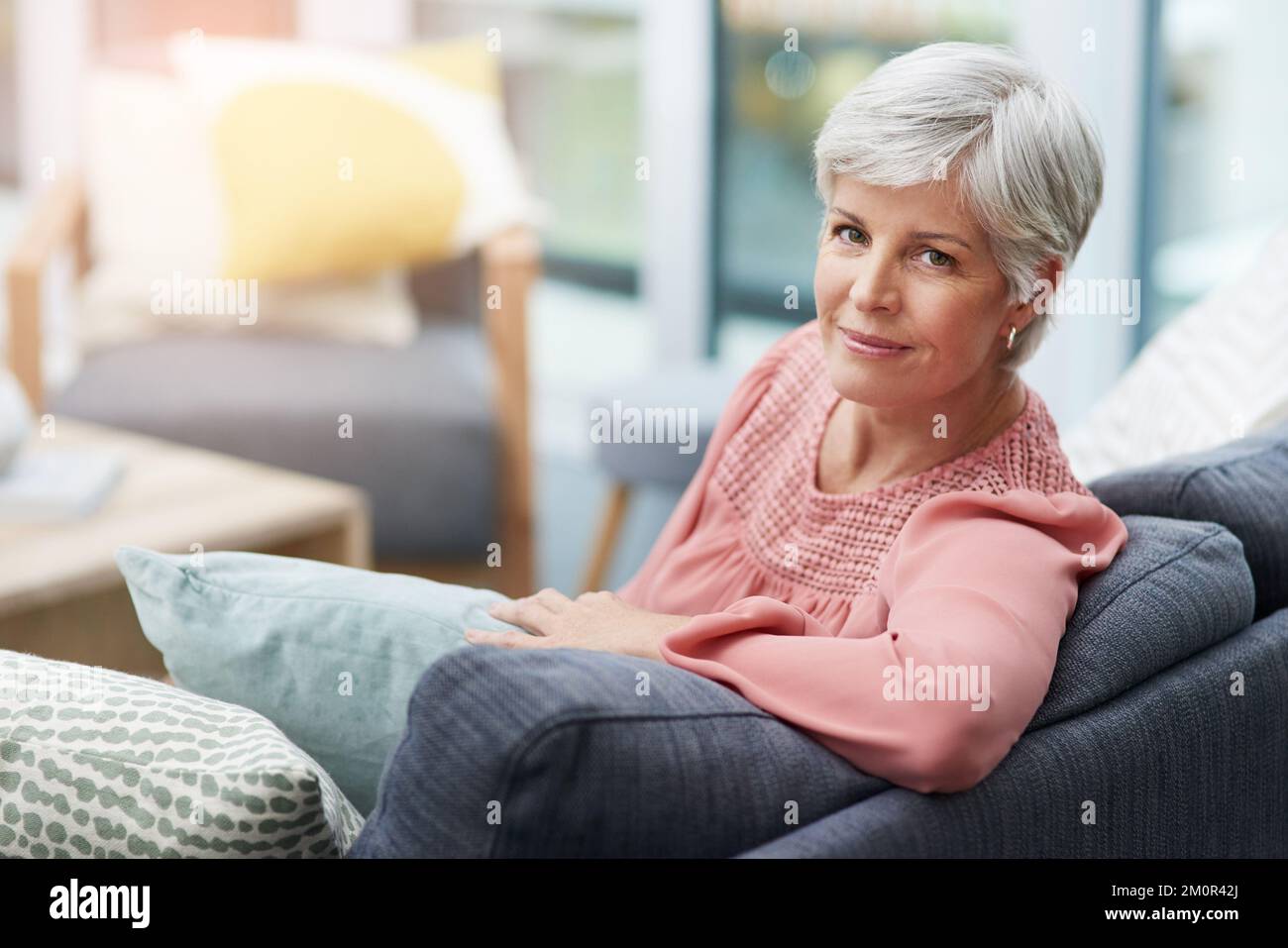 Woman relaxing on her own on a sofa hi-res stock photography and images ...