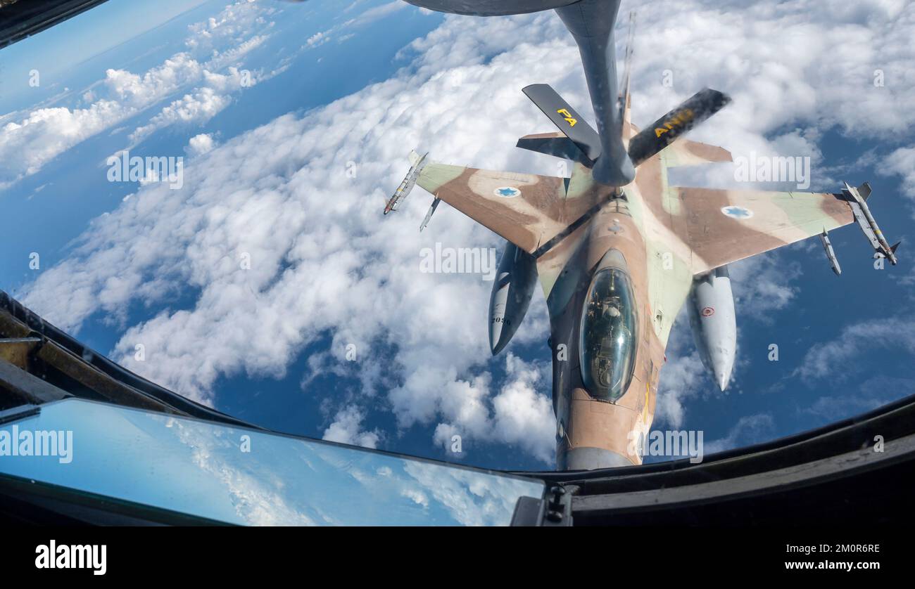 An Israeli Air Force F-16 Fighting Falcon refuels from a U.S. Air Force KC-135 Stratotanker assigned to the 340th Expeditionary Air Refueling Squadron, as part of a bilateral exercise over an undisclosed location in the U.S. Central Command area of responsibility, Nov. 30, 2022. The exercise demonstrated fighter aircraft integration and escort as well as refueling operations as part of the first of several exercises to maintain the ironclad commitment and bilateral aerial capability between the U.S. and Israeli Air Forces. (U.S. Air Force photo by Staff Sgt. Kirby Turbak) Stock Photo