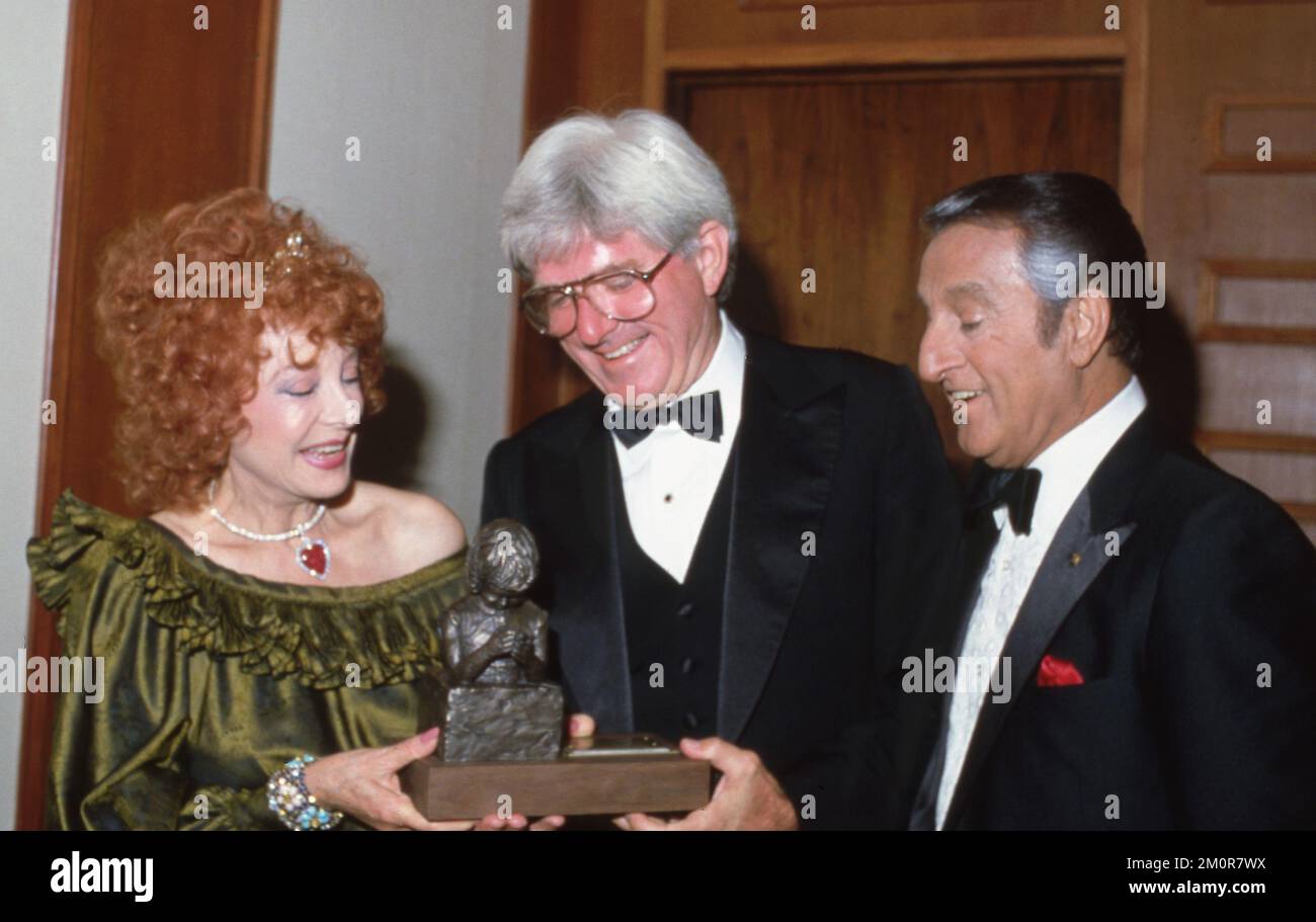 Danny Thomas with Rose Marie Thomas and Phil Donahue Circa 1980's Credit: Ralph Dominguez/MediaPunch Stock Photo