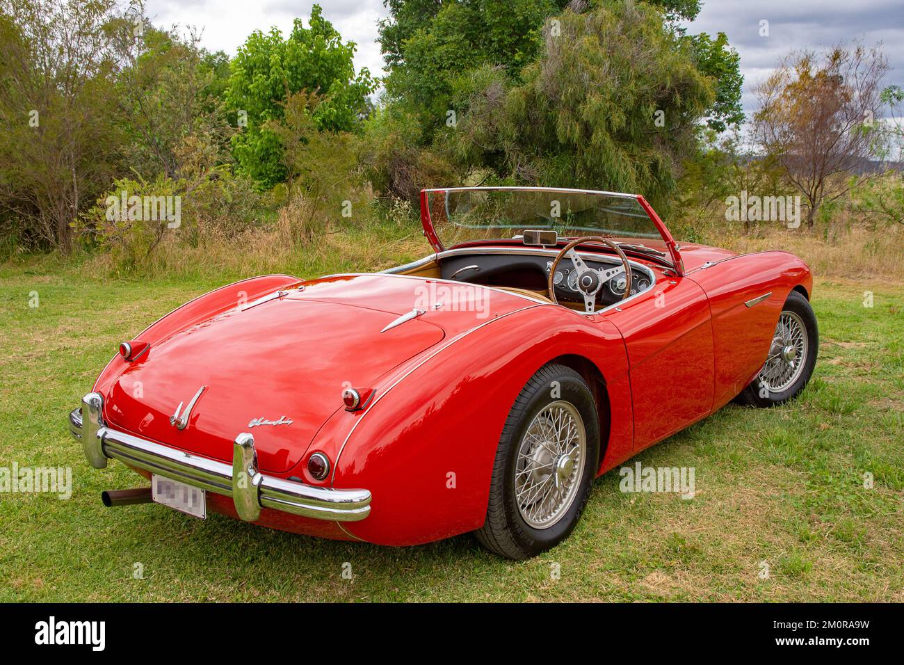 A red 1952 Austin Healy 100 roadster. Stock Photo