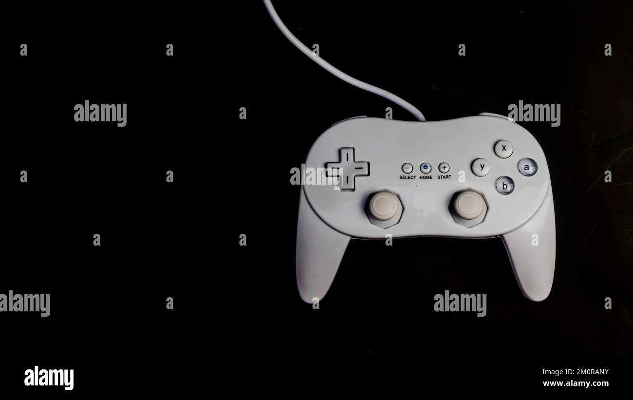 white joystick isolated on black background Stock Photo - Alamy