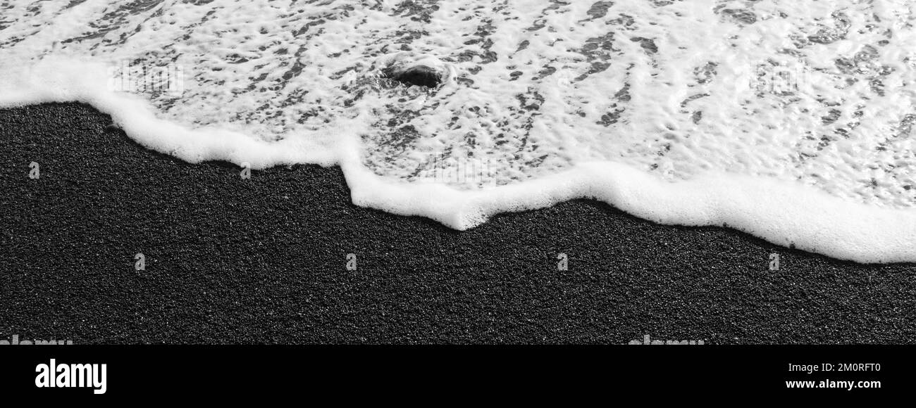 Contrasts on the black beach of Lanzarote. Horizontal banner Stock