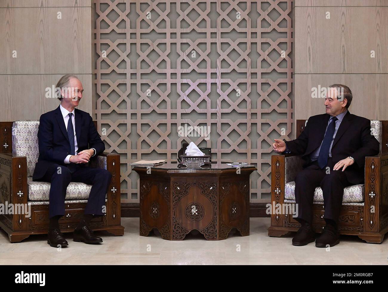 Damascus, Syria. 7th Dec, 2022. UN Special Envoy for Syria Geir Pedersen (L) speaks with Syrian Foreign Minister Faisal Mekdad in Damascus, Syria, Dec. 7, 2022. Pedersen said on Wednesday that the U.S.-led Western sanctions on Syria shouldn't block humanitarian assistance. Credit: Ammar Safarjalani/Xinhua/Alamy Live News Stock Photo