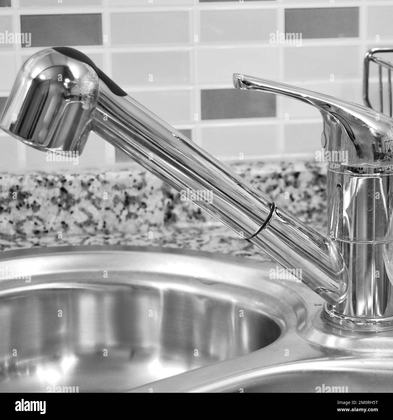 Interior of luxurious modern kitchen and stainless steel sink, tap and drain Stock Photo