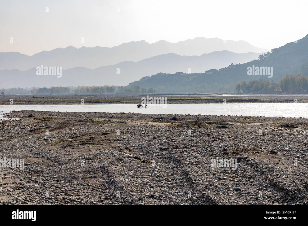 Beautiful landscape view of river early in the morning. worker bring sand from the sea Stock Photo