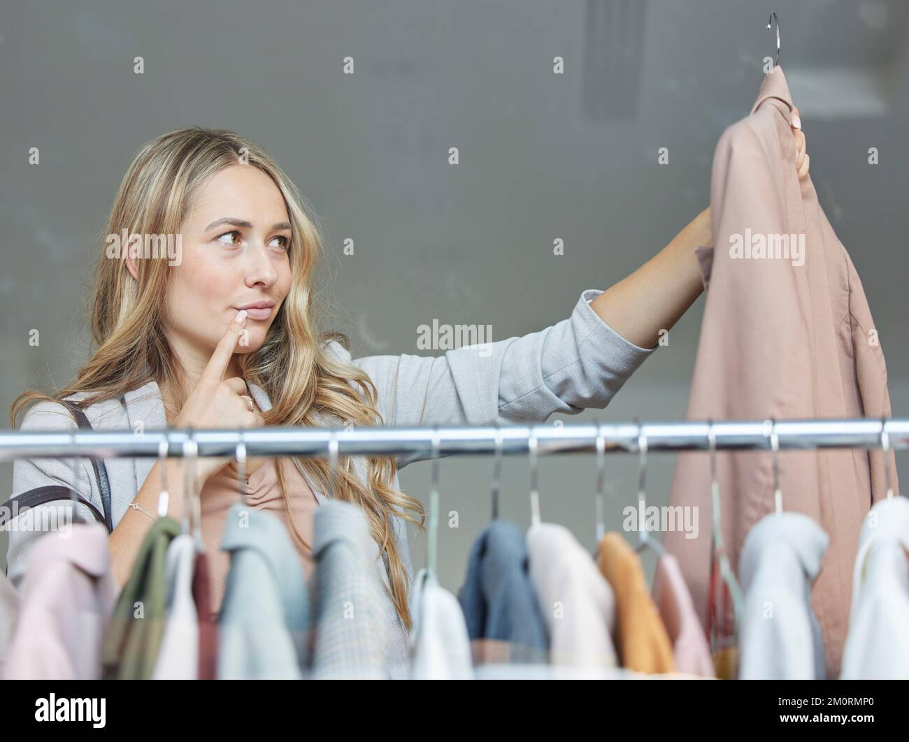 Woman, thinking and fashion designer clothing idea of retail production project in a office. Working woman employee think or planning a fabric design Stock Photo